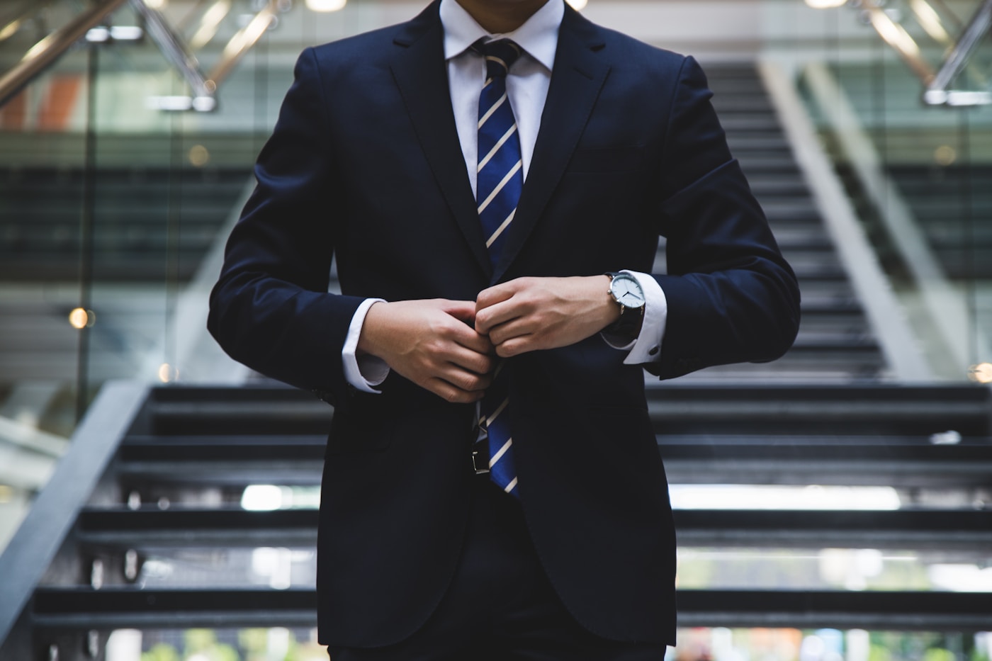 Executive reviewing personal finance control reports at a professional desk
