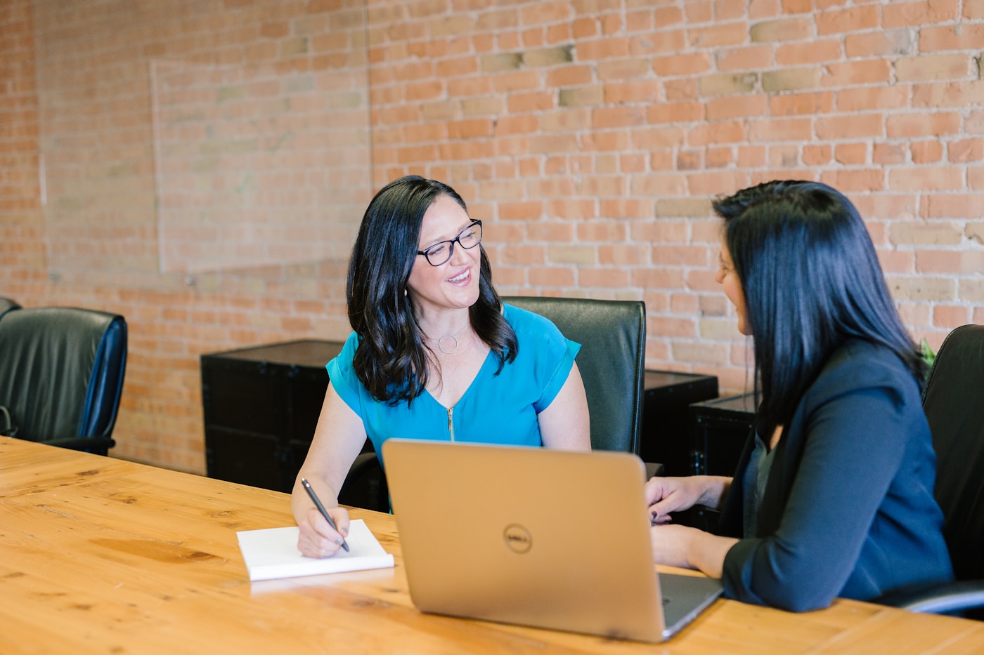 Professional reviewing generic financial statements at an office desk